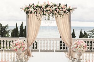 The,Wedding,Arch,Decorated,With,Flowers,Stands,In,The,Luxurious